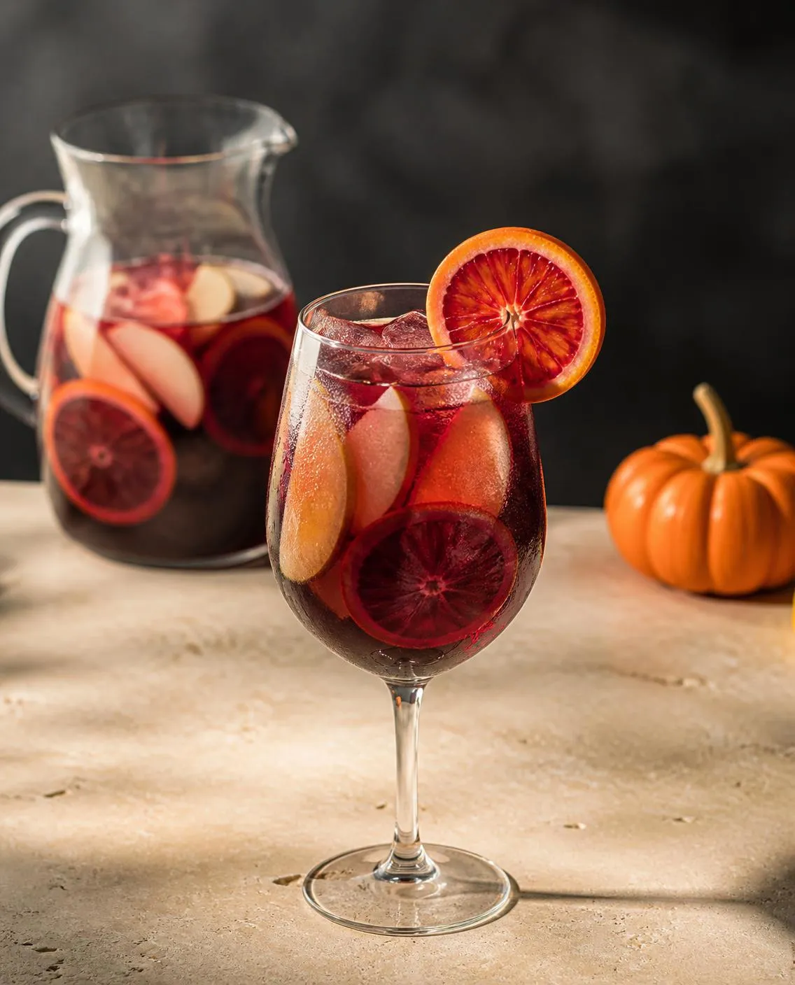Halloween Sangria in a wine glass with blood orange slice and colored sugar rim (optional) (AI-generated image)
